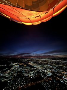 A view of the first light of sunrise seen from one of Apex Balloons' hot air balloons above Phoenix Arizona