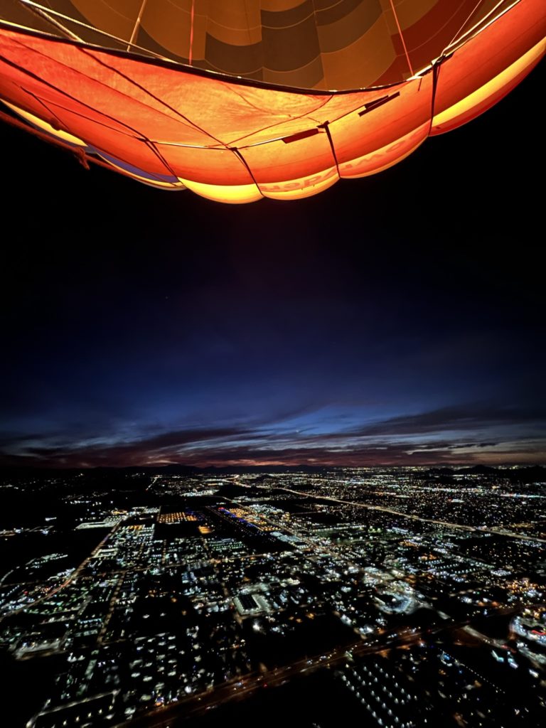 A view of the first light of sunrise seen from one of Apex Balloons' hot air balloons above Phoenix Arizona